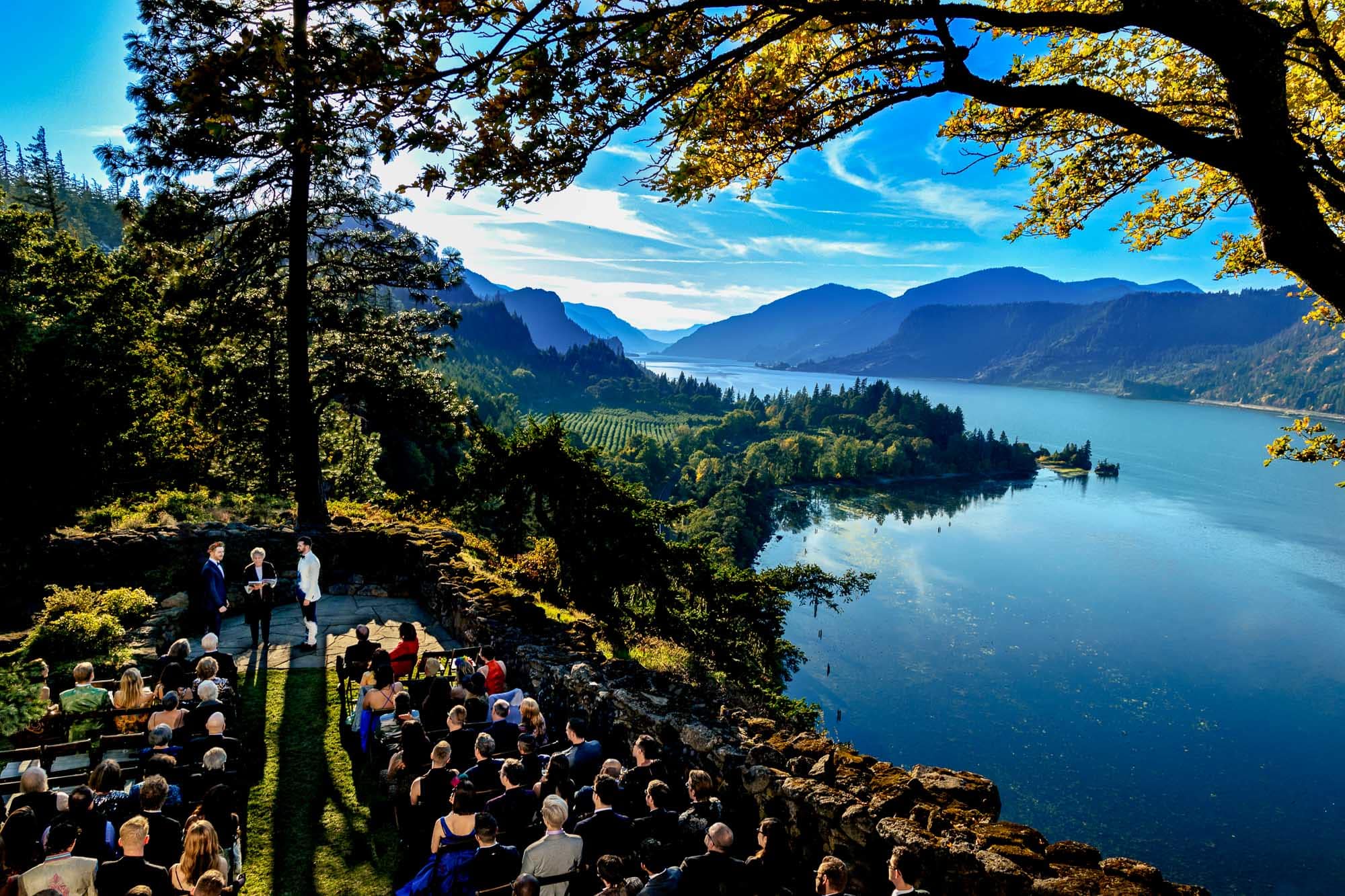 Groom and groom exchanging vows at The Griffin House on the Columbia Gorge River near Hood River, Oregon